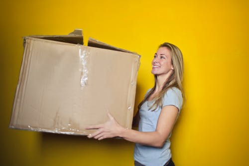 woman carrying a big box